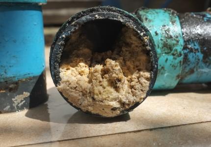 Pipe clogged with fats and grease