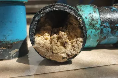 Pipe clogged with fats and grease